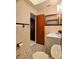 Bathroom view highlighting the vanity, toilet, tiled walls and floors, and wall mirror and wall accessories at 1262 Jeffords St, Clearwater, FL 33756