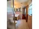 Bathroom showcasing a glass shower, vanity with sink, tiled floor and access to the bedroom at 1262 Jeffords St, Clearwater, FL 33756
