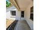 Inviting home entryway featuring tile flooring and a textured stucco exterior at 1262 Jeffords St, Clearwater, FL 33756