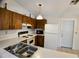 Galley kitchen featuring white appliances and spacious countertops at 1262 Jeffords St, Clearwater, FL 33756