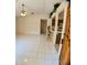 Bright living room featuring tile floors, vaulted ceiling, and breakfast bar to kitchen at 1262 Jeffords St, Clearwater, FL 33756