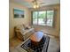 Cozy living room with a floral sofa, wood coffee table, area rug and ample natural light at 1262 Jeffords St, Clearwater, FL 33756