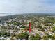 Aerial view of the neighborhood featuring clear skies and distant water at 1267 Woodlawn Ter, Clearwater, FL 33755