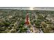 Aerial view of the neighborhood, highlighting the home's location near the water with lush surrounding trees at 1267 Woodlawn Ter, Clearwater, FL 33755