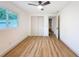 Bedroom showcasing hardwood floors and a closet at 1267 Woodlawn Ter, Clearwater, FL 33755