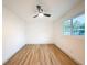 Bright bedroom with hardwood floors and ceiling fan at 1267 Woodlawn Ter, Clearwater, FL 33755