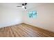 Bright bedroom with hardwood floors and a ceiling fan at 1267 Woodlawn Ter, Clearwater, FL 33755