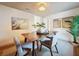 Cozy dining room area featuring a wooden table with seating and decorative accents at 1267 Woodlawn Ter, Clearwater, FL 33755