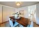 Elegant dining room with a wooden table, seating for four, and stylish decor at 1267 Woodlawn Ter, Clearwater, FL 33755