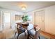 Stylish dining room showcasing a wooden table, seating, and decorative mirrors at 1267 Woodlawn Ter, Clearwater, FL 33755