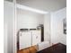 Convenient laundry area equipped with a washer and dryer, neatly tucked away at 1267 Woodlawn Ter, Clearwater, FL 33755