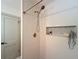 This shower features white tiling and a built-in niche for toiletries at 1267 Woodlawn Ter, Clearwater, FL 33755