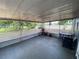 Spacious screened-in back porch for relaxing or entertaining with a small view at 12912 Leadwood Dr, Riverview, FL 33579