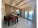 Cozy dining room area with chandelier lighting and sliding glass doors to the patio at 12912 Leadwood Dr, Riverview, FL 33579