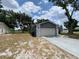 Spacious two-car garage and driveway provide plenty of parking at 12912 Leadwood Dr, Riverview, FL 33579