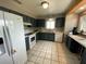 Bright kitchen features tile floors, modern appliances, and plenty of cabinet space at 12912 Leadwood Dr, Riverview, FL 33579