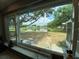 A tranquil lake view from the kitchen window brings nature indoors at 12912 Leadwood Dr, Riverview, FL 33579