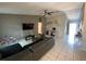 Spacious living area with tile flooring, vaulted ceiling, and neutral gray walls at 12912 Leadwood Dr, Riverview, FL 33579