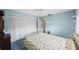 Bright bedroom with ceiling fan, closet and a window to let in natural light at 13563 Cordova Dr, Largo, FL 33774