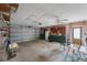 Spacious two-car garage featuring ample storage space, a utility sink, and a ceiling fan at 13563 Cordova Dr, Largo, FL 33774