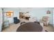 Bright living area with a ceiling fan, with views to the kitchen and comfortable seating areas at 13563 Cordova Dr, Largo, FL 33774