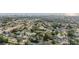 Neighborhood aerial view showcasing the community's landscape and a glimpse of the city skyline at 14000 104Th Ave, Largo, FL 33774