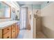 Bathroom featuring a spacious vanity area, a large shower, and modern fixtures at 14000 104Th Ave, Largo, FL 33774