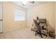 Cozy bedroom featuring bright walls, tiled flooring, and a desk at 14000 104Th Ave, Largo, FL 33774