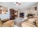 Spacious living room with cozy seating, fireplace, and seamless flow to other areas at 14000 104Th Ave, Largo, FL 33774