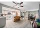 Open floor plan with kitchen, dining, and living areas featuring tile floors and ample seating at 14000 104Th Ave, Largo, FL 33774