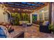 Inviting covered backyard patio with outdoor furniture, string lights, and dining space at 1436 30Th N Ave, St Petersburg, FL 33704