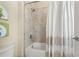 Bright bathroom featuring a tiled tub-shower combo with a decorative shower curtain and painted decor at 1436 30Th N Ave, St Petersburg, FL 33704