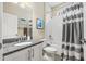 Bright bathroom features granite countertops, a shower-tub, and modern fixtures at 1436 30Th N Ave, St Petersburg, FL 33704