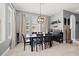 Modern dining room features a stylish light fixture and a functional bar area at 1436 30Th N Ave, St Petersburg, FL 33704