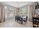 Charming dining area with tile flooring, large windows, and modern pendant lighting at 1436 30Th N Ave, St Petersburg, FL 33704