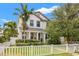 Beautiful two-story home featuring manicured landscaping and a charming white picket fence at 1436 30Th N Ave, St Petersburg, FL 33704