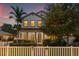 Charming two-story home with well-maintained landscaping and white picket fence at 1436 30Th N Ave, St Petersburg, FL 33704