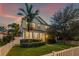 Beautiful two-story home featuring manicured landscaping and a charming white picket fence at 1436 30Th N Ave, St Petersburg, FL 33704