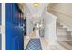 Inviting foyer with tile floors, staircase, and view into the living spaces at 1436 30Th N Ave, St Petersburg, FL 33704