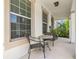 Cozy front porch with seating area and views of lush landscaping at 1436 30Th N Ave, St Petersburg, FL 33704