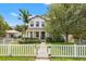 Charming two-story home featuring a well-manicured front yard with a classic white picket fence at 1436 30Th N Ave, St Petersburg, FL 33704