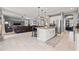 Open-concept kitchen with granite island, stainless appliances, and seamless flow to the living area at 1436 30Th N Ave, St Petersburg, FL 33704