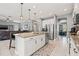 Bright kitchen with island seating, stainless appliances, open to the living area and office space at 1436 30Th N Ave, St Petersburg, FL 33704
