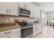 Well-equipped kitchen featuring stainless steel appliances, granite countertops, and ample cabinet space at 1436 30Th N Ave, St Petersburg, FL 33704