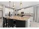 Bright kitchen featuring a large island with seating, granite counters, and stainless steel appliances at 1436 30Th N Ave, St Petersburg, FL 33704