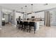 Open kitchen with white cabinets, stainless steel appliances, and center island with seating at 1436 30Th N Ave, St Petersburg, FL 33704