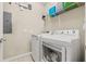 Well-equipped laundry room with modern washer and dryer units and overhead storage space at 1436 30Th N Ave, St Petersburg, FL 33704