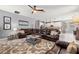 Spacious living room that flows into kitchen, featuring large sectional and neutral decor at 1436 30Th N Ave, St Petersburg, FL 33704