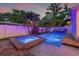 Backyard with pool, spa, and lush tropical landscaping creates a private and serene outdoor living space at 1436 30Th N Ave, St Petersburg, FL 33704