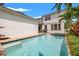 A backyard pool and spa offer a refreshing escape with a lush tropical landscape and inviting atmosphere at 1436 30Th N Ave, St Petersburg, FL 33704